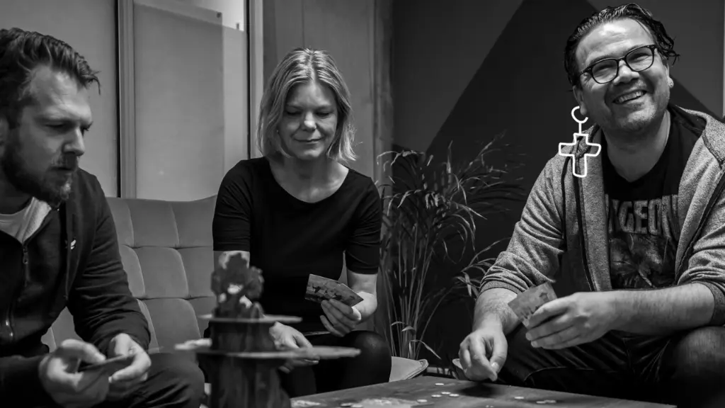 Board game, rock and roll and big smiles in the office